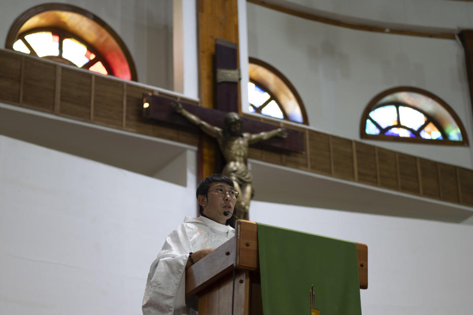 Sanjaajav Tserenkhand, the Assistant Priest of Saint Peter and Paul Cathedral, conducts a mass at the Catholic Church in Ulaanbaatar, Mongolia on Monday, Aug. 28, 2023. When Pope Francis travels to Mongolia this week, he will in some ways be completing a mission begun by the 13th century Pope Innocent IV, who dispatched emissaries east to ascertain the intentions of the rapidly expanding Mongol Empire and beseech its leaders to halt the bloodshed and convert. (AP Photo/Ng Han Guan)