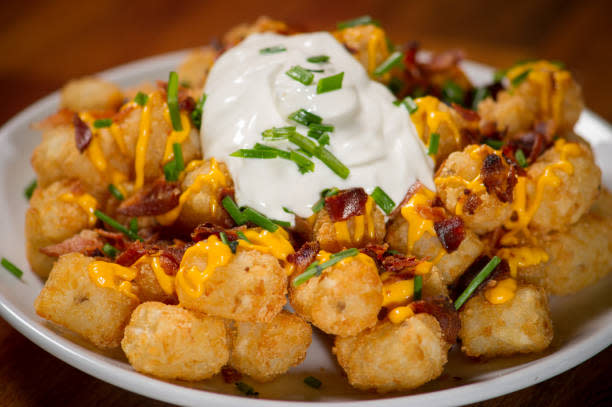 Loaded Tater Tots can take many forms—all magically delicious. (Photo: Getty)