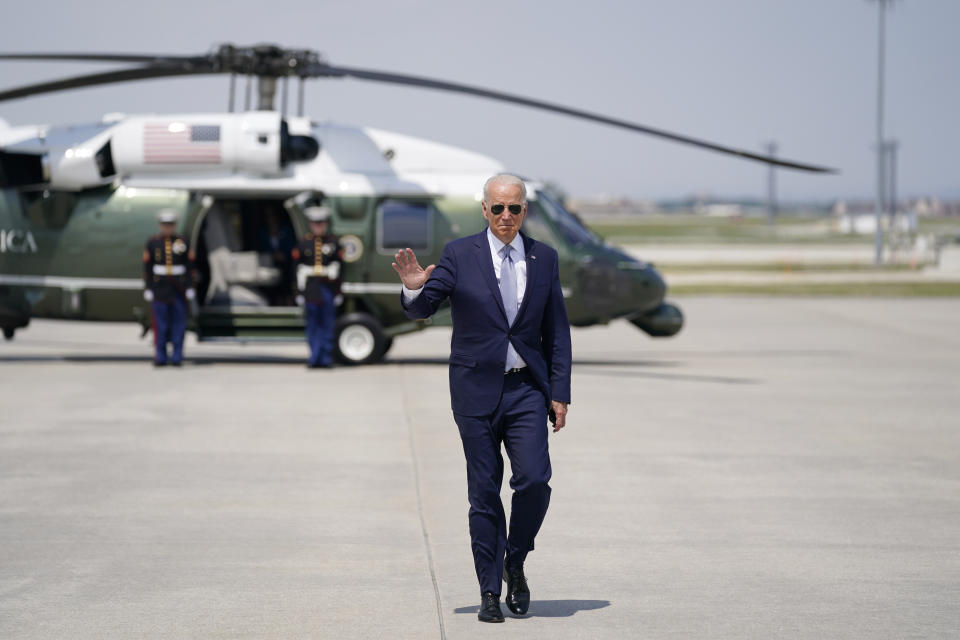 President Joe Biden waves before boarding Air Force One at O'Hare International Airport, Wednesday, July 7, 2021, in Chicago. (AP Photo/Evan Vucci)