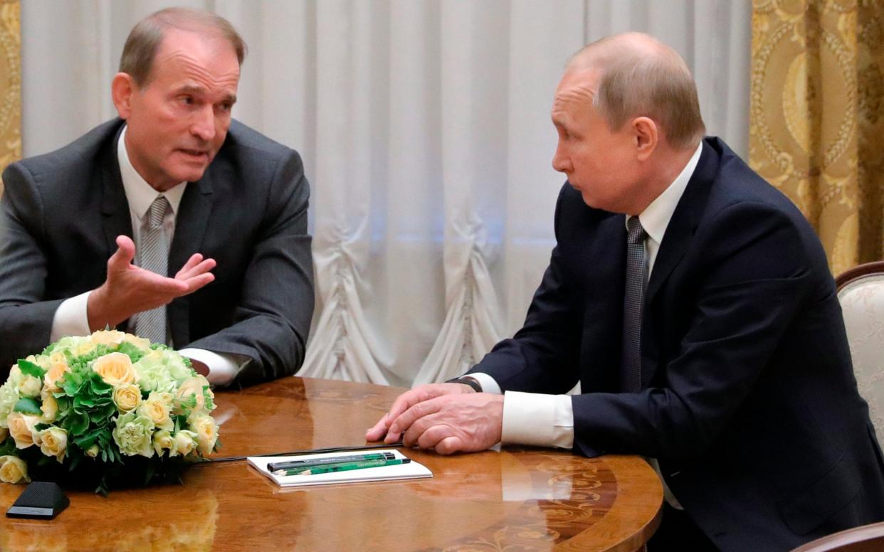 Viktor Medvedchuk and Vladimir Putin have called each other personal friends - Mikhail Klementyev/Kremlin Pool via AP