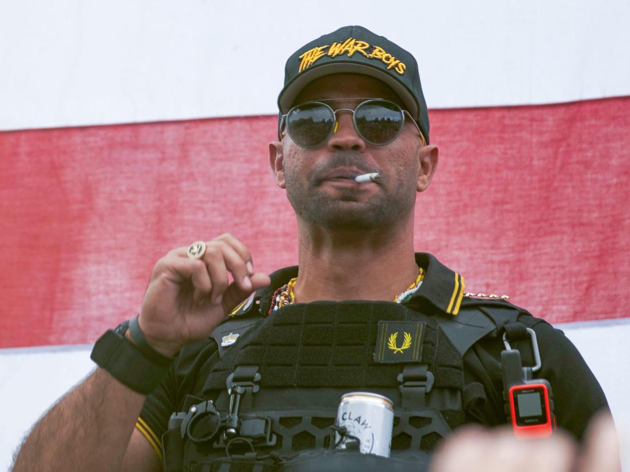 In this Sept. 26, 2020, file photo, Proud Boys leader Henry "Enrique" Tarrio wears a hat that says The War Boys during a rally in Portland, Ore.