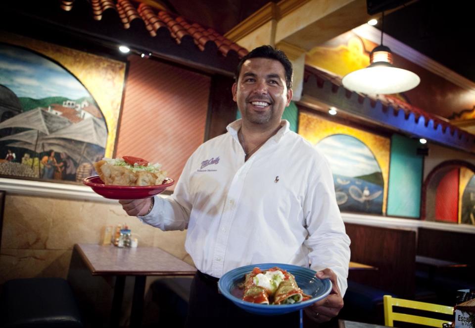 Juan Macias, owner and founder of the Mexican Restaurant Mi Casita, poses in 2015 in the original Mi Casita off Raeford Road in the Tallywood Shopping Center.