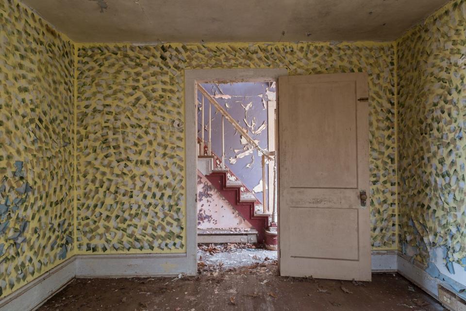 A stairwell in an abandoned house.