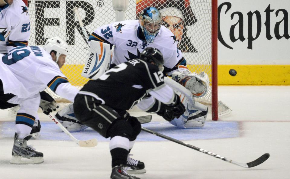 Los Angeles Kings right wing Marian Gaborik, front, of Slovakia, tries to get a shot in on San Jose Sharks goalie Alex Stalock as center Joe Thornton reaches in during the second period in Game 6 of an NHL hockey first-round playoff series, Monday, April 28, 2014, in Los Angeles. (AP Photo)