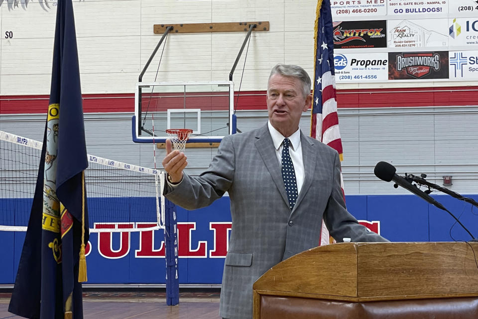 FILE - In this Aug. 12, 2021 file photo, Idaho Gov. Brad Little urges people to get vaccinated against the coronavirus during a visit to Nampa High School in Nampa Idaho. Mainstream Idaho Republicans who support Little are concerned about a takeover by the surging far-right wing of the party are asking Democrats, Independents or other affiliated voters to register as Republicans to vote in the party's May primary. (AP Photo/Keith J. Ridler, File)