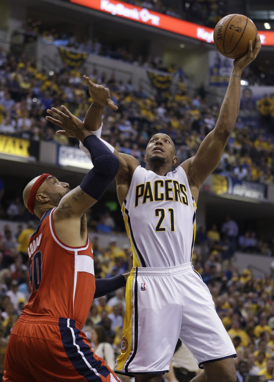 Indiana Pacers forward David West, right, shoots over Washington Wizards forward Drew Gooden during the second half of game 5 of the Eastern Conference semifinal NBA basketball playoff series Tuesday, May 13, 2014, in Indianapolis. (AP Photo/Darron Cummings)