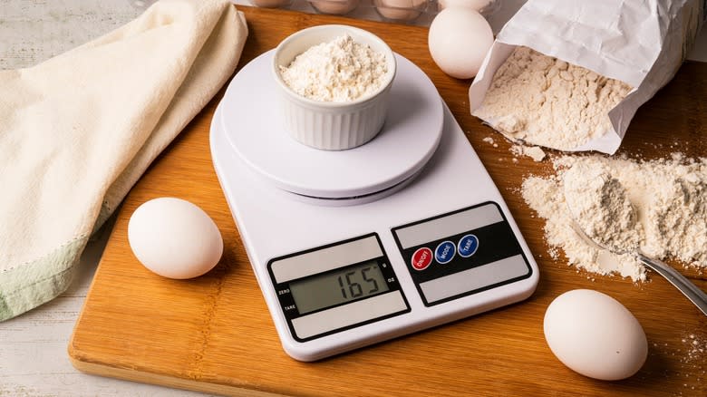 digital scales weighing ramekin of flour