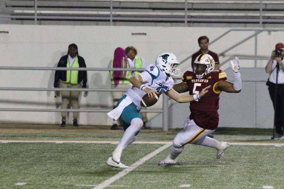 Louisiana-Monroe defensive tackle Quincy Ledet (5) closes in on Coastal Carolina quarterback Grayson McCall during the Chanticleers' 28-21 victory on Oct. 8 in Monroe, Louisiana. Ledet, a 19-game starter the past two seasons, announced Monday he will transfer to Texas Tech.