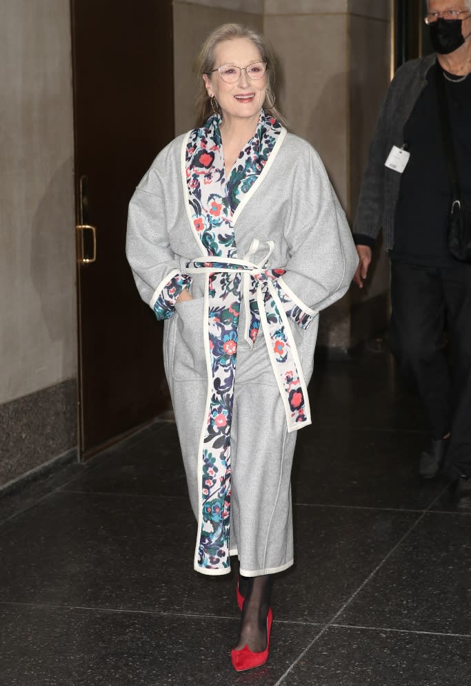 Meryl Steep is spotted wearing leaving the ‘Today’ show in a heather gray Tanya Taylor coat featuring a floral lining and belted waist. - Credit: Splash