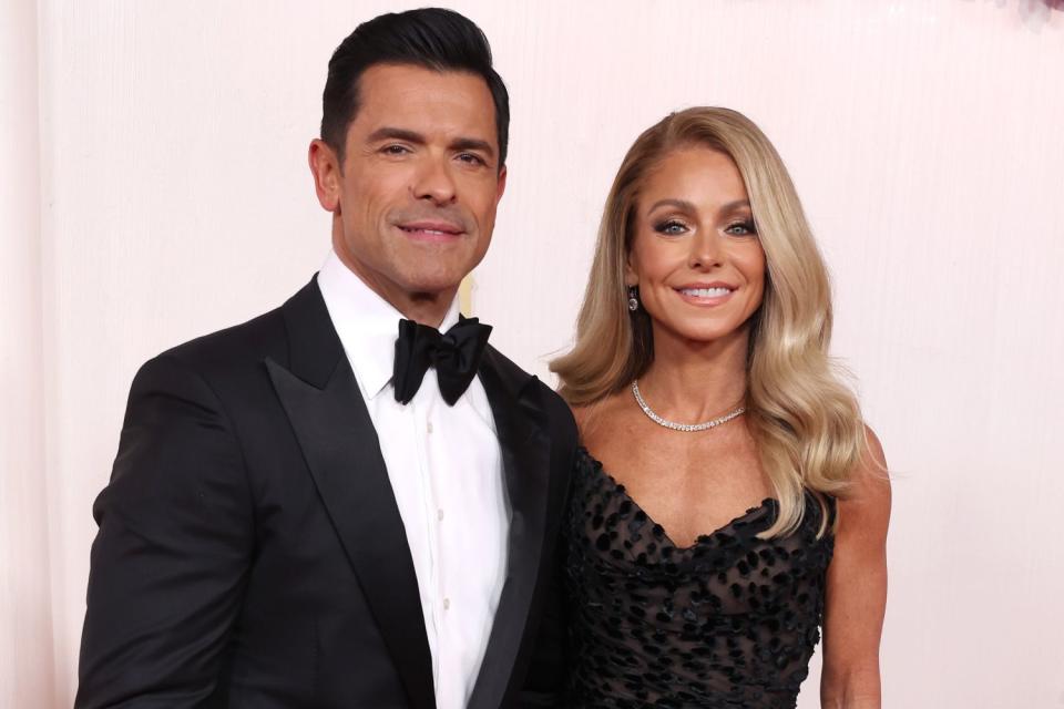 <p>Kevin Mazur/Getty</p> Mark Consuelos and Kelly Ripa at the 2024 Oscars