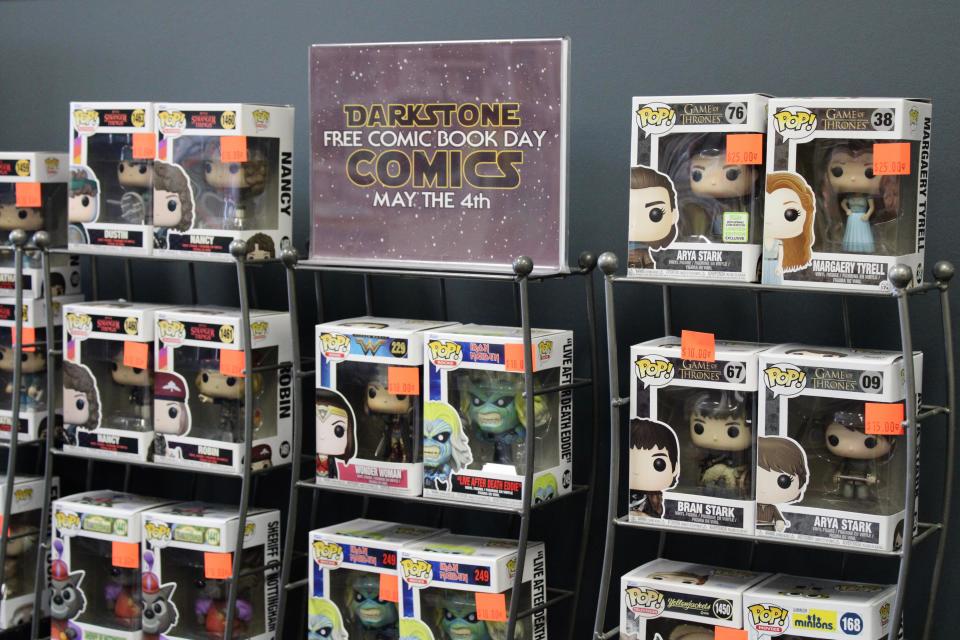 Funko Pop! figurines and free comic book day is advertised at Darkstone Comics on April 30, 2024. The shop is located in the Brotherhood Plaza in Washingtonville.