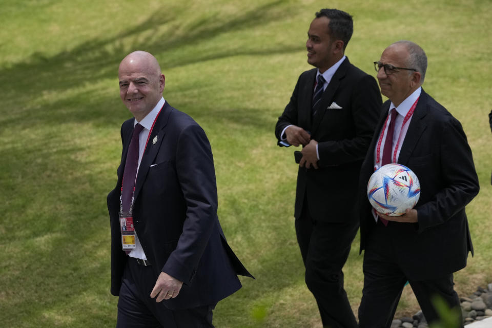 FIFA President Gianni Infantino, left, walks during the G20 Summit at the Nusa Dua, Bali, Indonesia on Tuesday, Nov. 15, 2022. (AP Photo/Achmad Ibrahim, Pool)