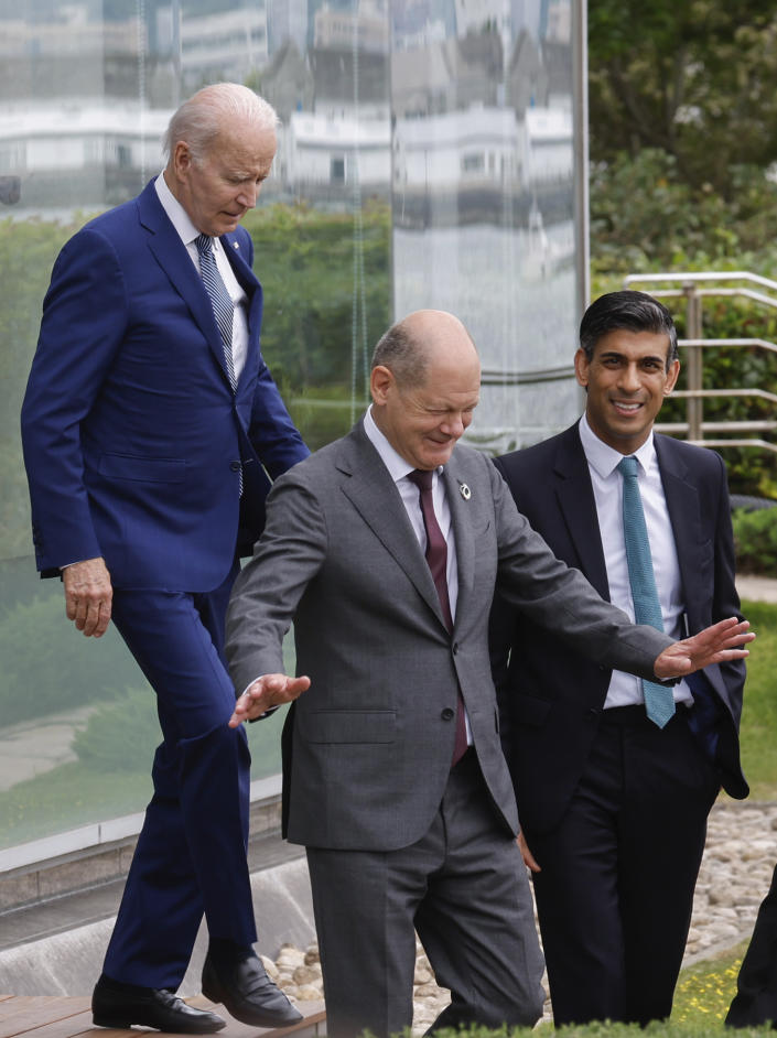 From left, U.S. President Joe Biden, Germany's Chancellor Olaf Scholz and Britain's Prime Minister Rishi Sunak walk to participate in a family photo with G7 leaders before their working lunch meeting on economic security during the G7 summit, at the Grand Prince Hotel in Hiroshima, western Japan Saturday, May 20, 2023. (Jonathan Ernst/Pool Photo via AP)