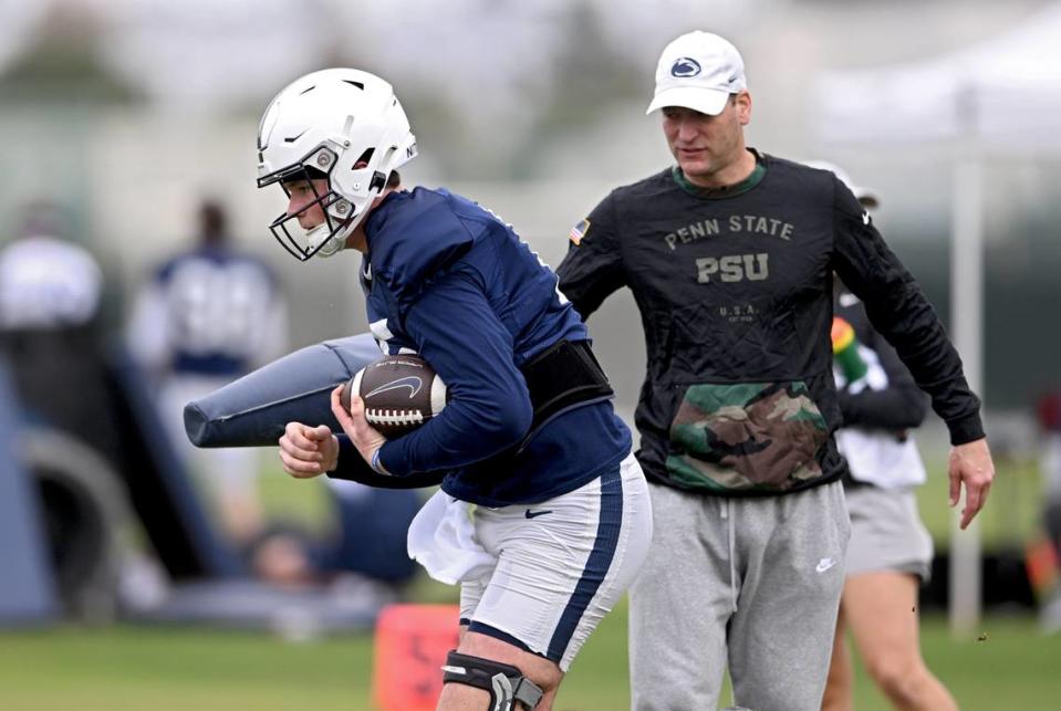 Penn State quarterback Drew Allar runs a drill with offensive coordinator Mike Yurcich during practice for the Rose Bowl at Dignity Health Sports Park in Los Angeles on Thursday, Dec. 29, 2022.