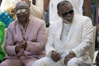 Ron Isley, right, and Ernie Isley pose for a photo with the street sign dedicated to them during a street renaming ceremony, Thursday, June 24, 2021, in Teaneck, N.J. Two New Jersey towns have renamed streets in honor of the Isley Brothers, the legendary R&B group that behind songs such as "Shout," "Twist and Shout" and "It's Your Thing." Ron Isley and Ernie Isley attended separate ceremonies Thursday in Teaneck and Englewood, neighboring towns outside New York City where they lived during the band's heyday in the 1960s. (AP Photo/Mary Altaffer)