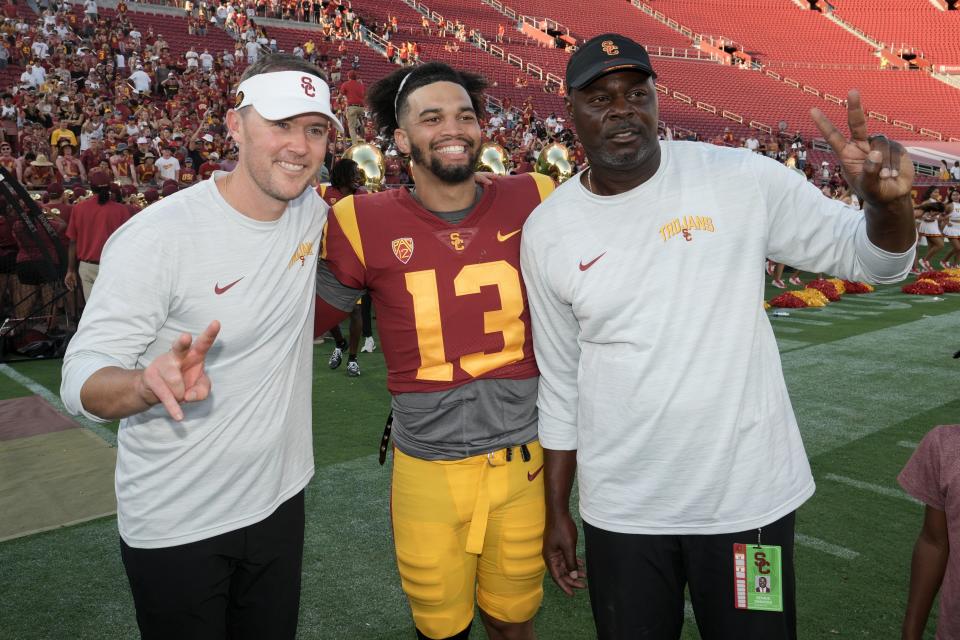 Sep 3, 2022; Los Angeles, California, USA; Southern California Trojans coach Lincoln Riley (left) and quarterback Caleb Williams (center) and outside wide receivers coach Dennis Simmons pose after a game against the Rice Owls at United Airlines Field at Los Angeles Memorial Coliseum. Mandatory Credit: Kirby Lee-USA TODAY Sports