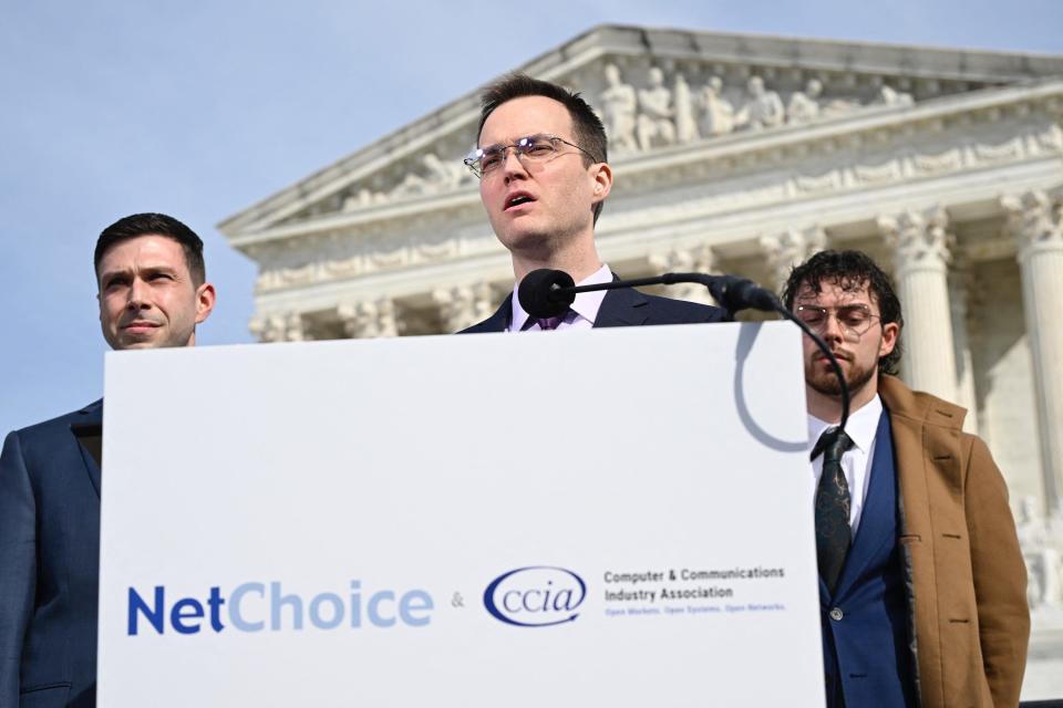 Chris Marchese, left, director of NetChoice Litigation Center, listens as Matt Schruers, president and CEO of the Computer & Communications Industry Association, addresses reporters outside the Supreme Court on Feb. 26, 2024.