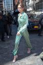 <p>In personally monogrammed green striped silk pajamas by Morgan Lane with white Stuart Weitzman sandals and clear round glasses while leaving her apartment in NYC. </p>