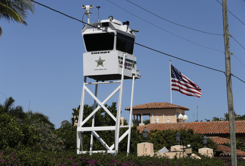 FILE - In this April 7, 2017, file photo, a Palm Beach, Fla. County Sheriff's lookout tower sits outside of President Donald Trump's Mar-a-Lago resort in Palm Beach, Fla. It’s widely estimated that each trip to the resort costs taxpayers $3 million, based on a government study of the cost of a 2013 trip to Florida by President Barack Obama. But that trip was more complicated and the study’s author says it can’t be used to calculate the cost of Trump’s travel. This weekend, Trump is making his seventh visit to Mar-a-Lago since becoming president. (AP Photo/Lynne Sladky, File)