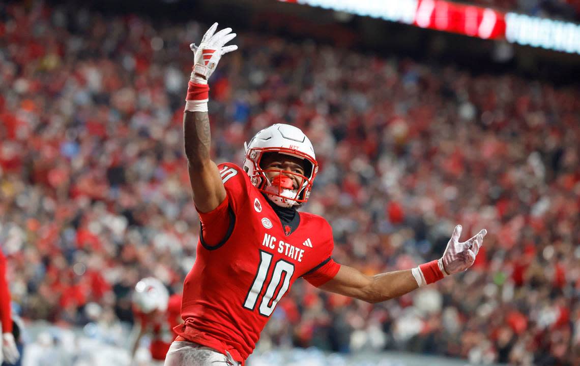 N.C. State wide receiver KC Concepcion (10) celebrates after scoring on a 11-yard touchdown reception during the first half of N.C. State’s game against UNC at Carter-Finley Stadium in Raleigh, N.C., Saturday, Nov. 25, 2023.