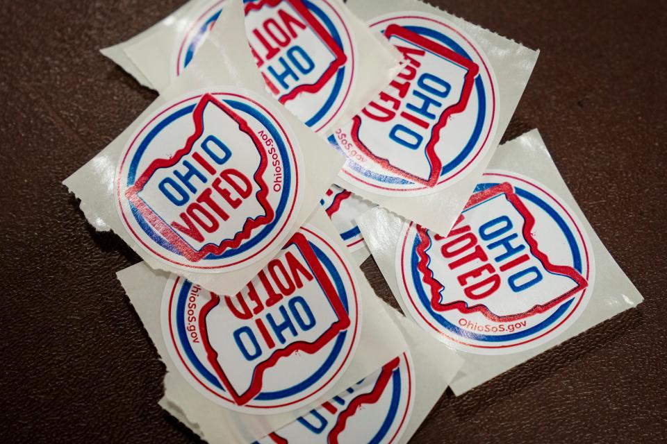 Stickers are given out to voters who cast their ballots during a special election for Issue 1 at the Schiller Recreation Center in German Village.