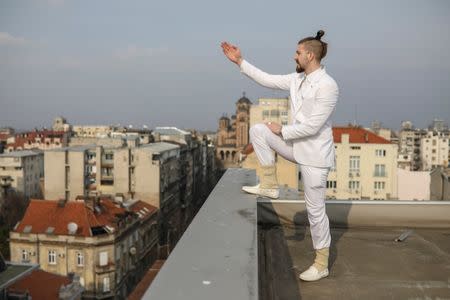 Student and 2017 presidential candidate Luka Maksimovic, 25, poses for a picture as his alter ego 'Ljubisa "Beli" Preletacevic' a parody of the worst politician in the Balkans,in Belgrade, Serbia, March 14, 2017. Picture taken March 14. REUTERS/Marko Djurica