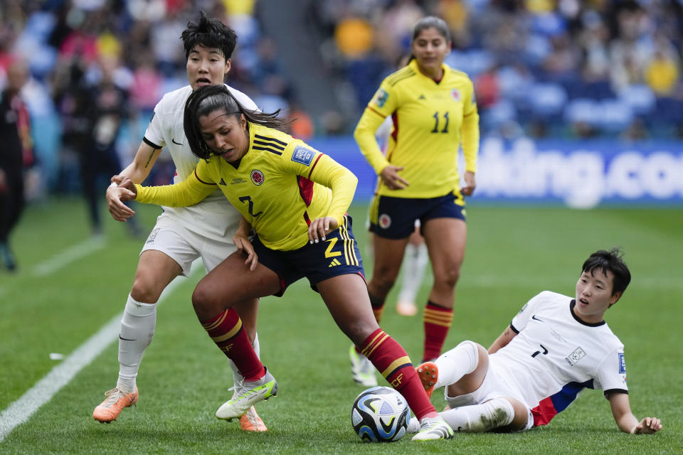 From left, South Korea's Lee Geum-min, Colombia's Manuela Vanegas, and South Korea's Son Hwa-yeon vie for the ball during the Women's World Cup Group H soccer match between Colombia and South Korea at the Sydney Football Stadium in Sydney, Australia, Tuesday, July 25, 2023. (AP Photo/Rick Rycroft)
