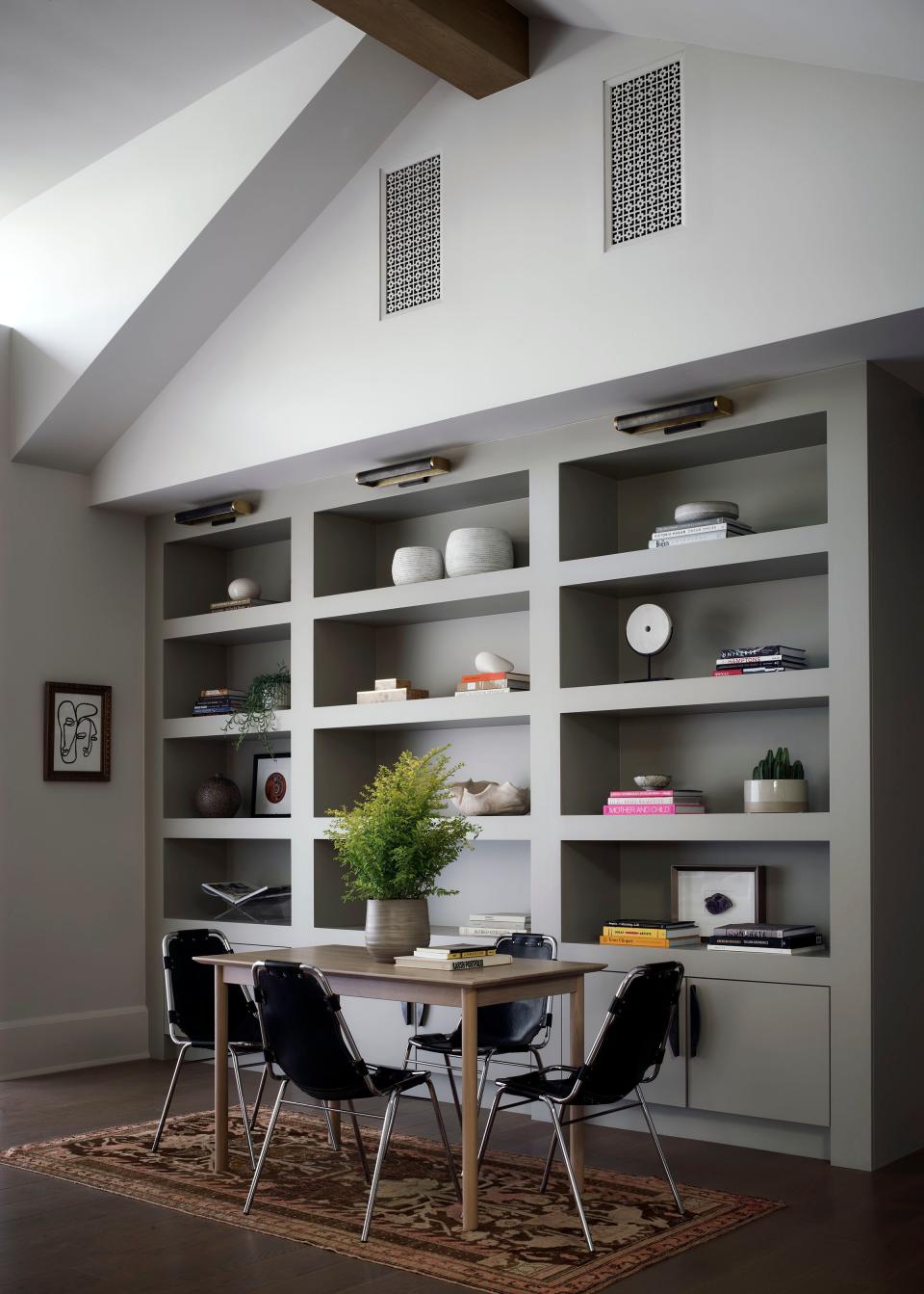 In the family room, vintage chrome-and-leather Les Arcs chairs, designed in the 1960s by Charlotte Perriand for the Les Arcs Ski Resort, were paired with a contemporary oak table from Sun at Six.