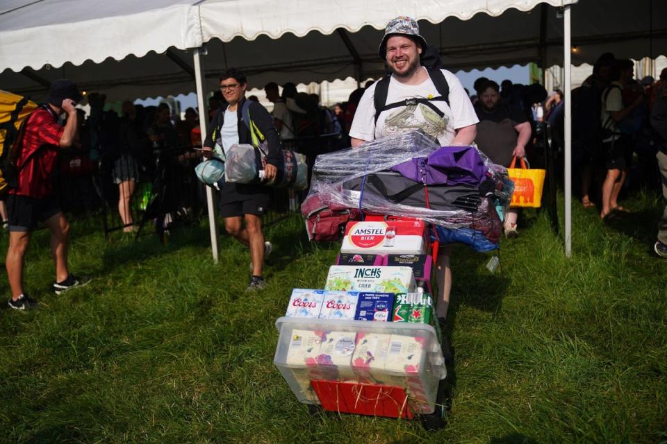 <p>People arrive for the Glastonbury Festival at Worthy Farm in Somerset</p> (Yui Mok/PA Wire)