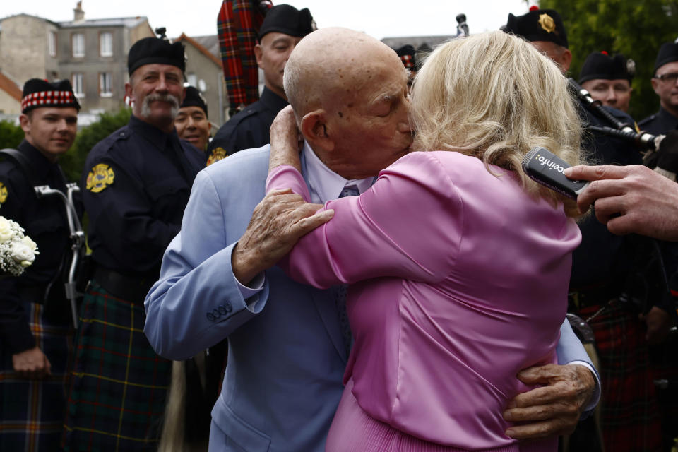 US WWII veteran Harold Terens, 100, left, and Jeanne Swerlin, 96, kiss as they arrive to celebrate their wedding at the town hall of Carentan-les-Marais, in Normandy, northwestern France, on Saturday, June 8, 2024. Together, the collective age of the bride and groom was nearly 200. But Terens and his sweetheart Jeanne Swerlin proved that love is eternal as they tied the knot Saturday inland of the D-Day beaches in Normandy, France. (AP Photo/Jeremias Gonzalez)
