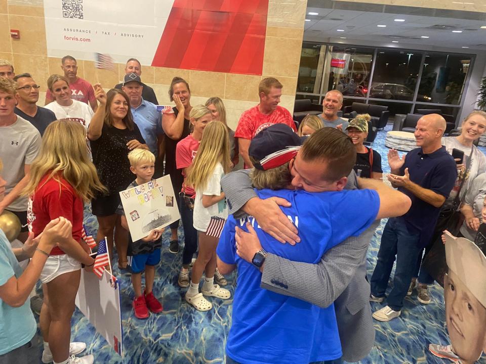 Vietnam veteran Anthony Van Zant, left,  hugs Nixa Mayor Pro Tem Jarad Giddens on Tuesday at Springfield-Branson National Airport after returning from Honor Flight of the Ozarks.