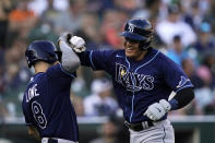 Tampa Bay Rays' Yu Chang is greeted by Brandon Lowe after a solo home run during the second inning of a baseball game against the Detroit Tigers, Saturday, Aug. 6, 2022, in Detroit. (AP Photo/Carlos Osorio)