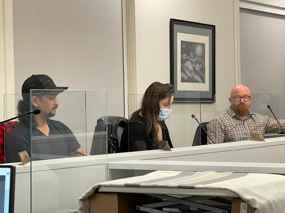 Iqaluit City Coun. Kim Smith, middle, delivers a statement in response to concerns raised by fellow councillor Paul Quassa regarding Pride flags painted at crosswalks in the city.