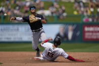 Minnesota Twins Joey Gallo is forced out at second as New York Yankees second baseman Anthony Volpe throws to first on a double play off the bat of Ryan Jeffers in the second inning of a spring training baseball game in Fort Myers, Fla., Monday, March 13, 2023. (AP Photo/Gerald Herbert)