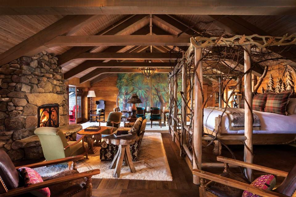 The wood and stone interior of a guest room at Lake Placid Lodge, voted one of the best resorts in New York State