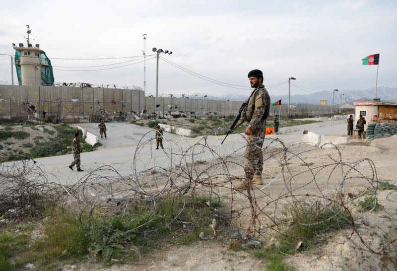 An Afghan National Army (ANA) soldier stands guard outside Bagram prison, north of Kabul, Afghanistan