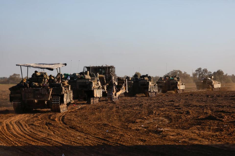 A convoy of Israeli military rolls into Israel from Gaza, amid the ongoing conflict between Israel and the Palestinian militant group Hamas, on Jan. 5, 2024. 