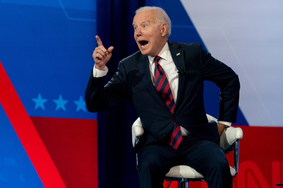 President Joe Biden interacts with members of the audience during a commercial break for a CNN town hall at Mount St. Joseph University in Cincinnati on Wednesday night. The visit to the Catholic university sparked some controversy because of the president's views on abortion.