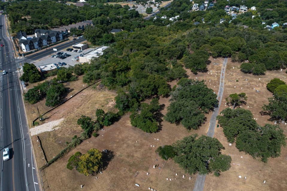 Bethany Cemetery in East Austin, shown to the right, sits next to the 5.5 acres at Springdale Road and East 12th Street where Heartwood Real Estate Group proposes to build a pair of five-story apartment buildings. If the project is approved, about 70% of the units would be affordable for lower income residents.