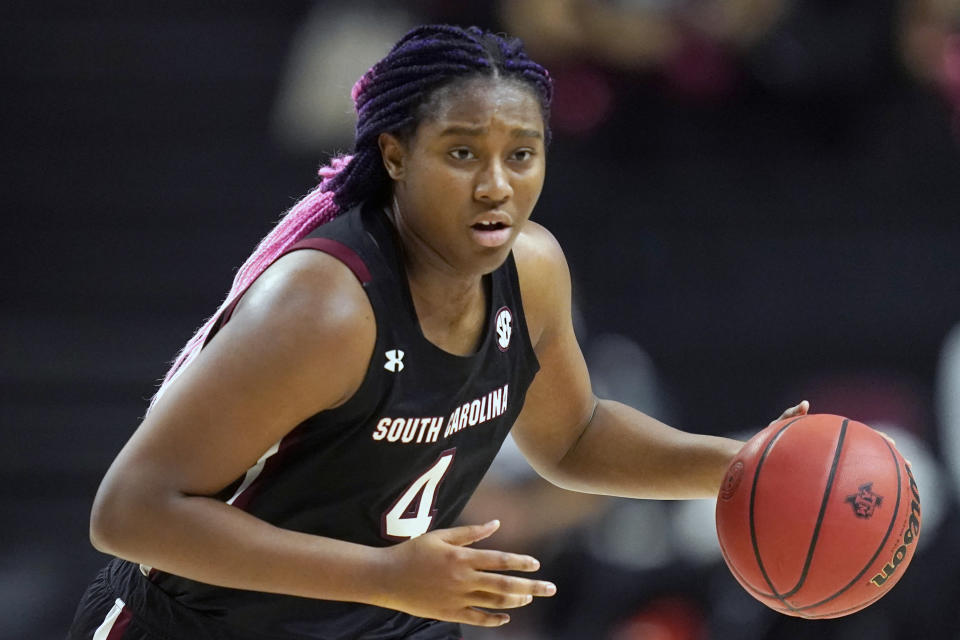 FILE - South Carolina forward Aliyah Boston (4) brings the ball down against Texas A&M during the first half of an NCAA college basketball game in College Station, Texas, in this Sunday, Feb. 28, 2021, file photo. Boston has made The Associated Press All-America first team, announced Wednesday, March 17, 2021.(AP Photo/Sam Craft, File)