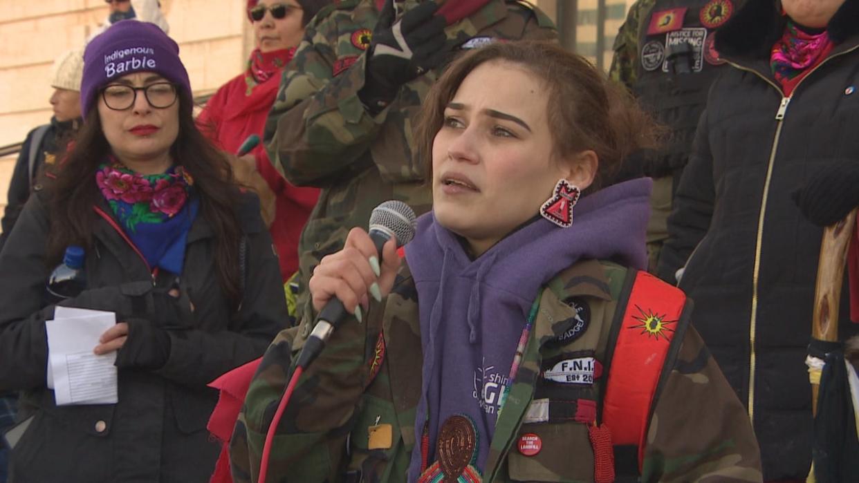 Cambria Harris, daughter of Morgan Harris, addresses the crowd from the steps of the legislative building on Friday. (Jeff Stapleton/CBC - image credit)