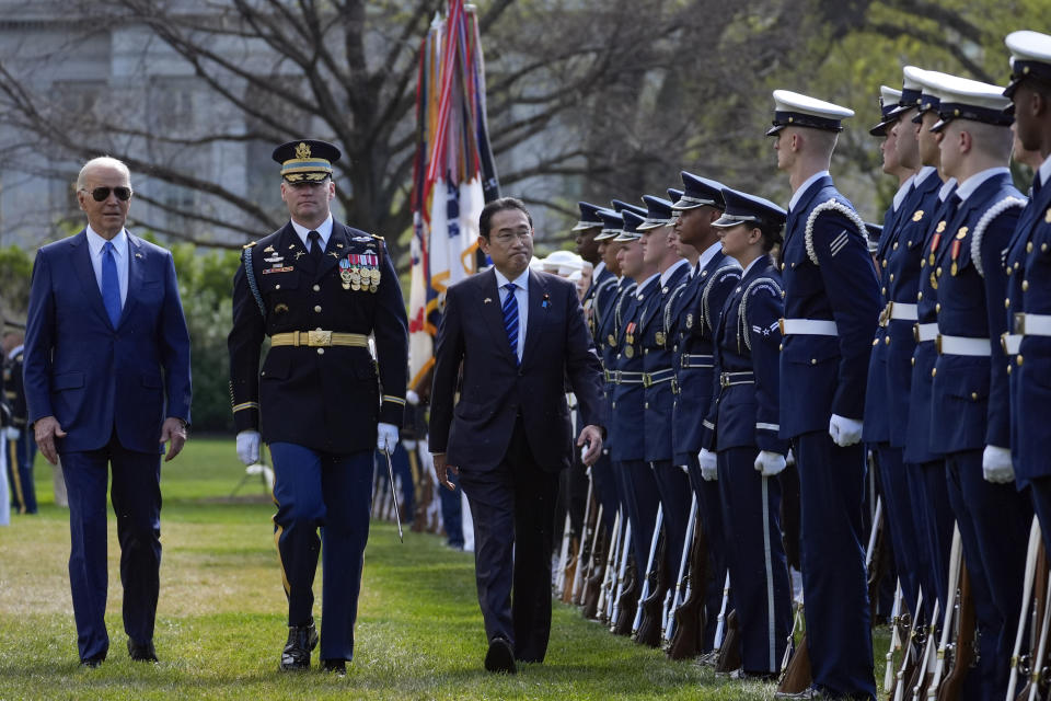 President Joe Biden and Japanese Prime Minister Fumio Kishida review the troops with Col. David Rowland, commander of the 3rd U.S. Infantry Regiment, The Old Guard, during a State Arrival Ceremony on the South Lawn of the White House, Wednesday, April 10, 2024, in Washington. (AP Photo/Evan Vucci)