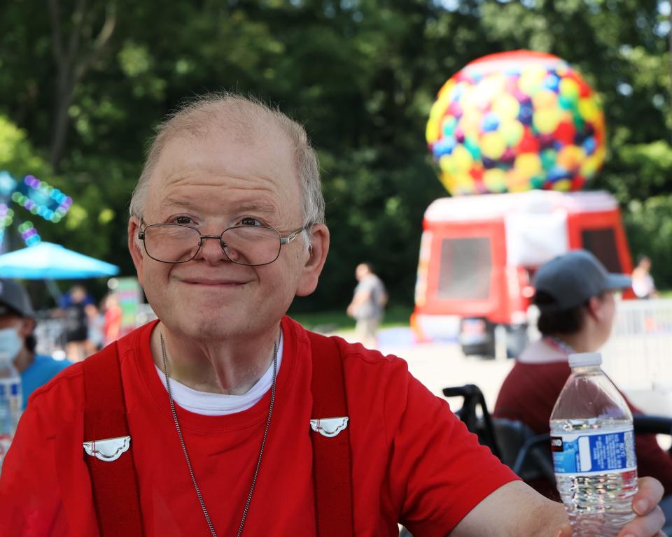 Dan smiles as he takes in all the fun around him at the carnival hosted by JARC in 2023.
