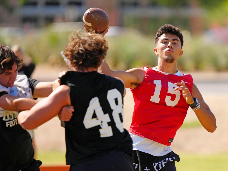 Hamilton quarterback Rich Lucero (15) passes during practice at Hamilton High School on the Chandler Unified School District Spring Football Jamboree on May 14, 2024, in Chandler, Arizona.