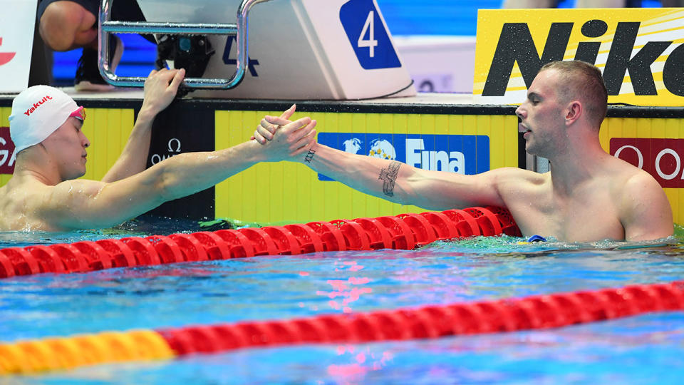 Kyle Chalmers appeared to go against the grain in shaking Sun Yang's hand. (Photo by Quinn Rooney/Getty Images)