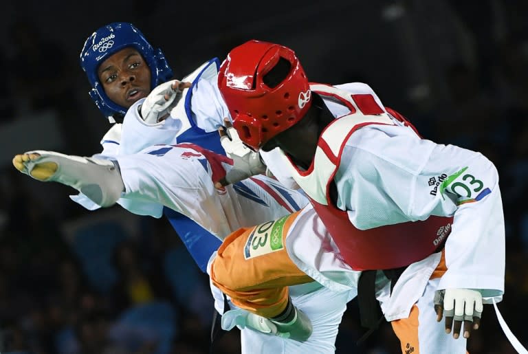 British number one Lutalo Muhammad (L) was forlorn at coming so close to the title against Ivory Coast's Cheick Sallah Cisse in the men's taekwondo -80kg gold medal bout