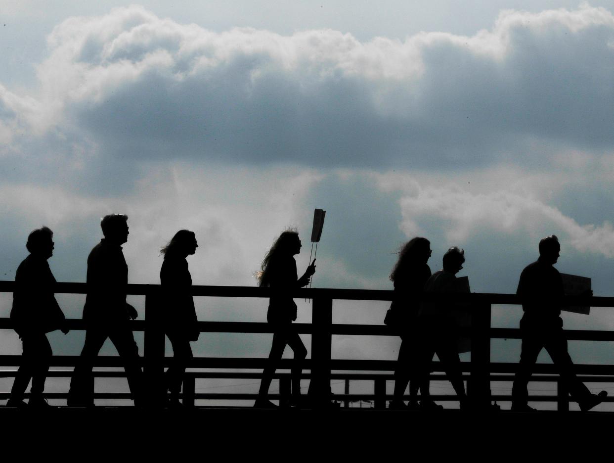 Protestors march to advocate change during the Green Bay Climate Strike rally hosted by Youth Climate Action Team Friday, Sept. 20, 2019, located at CityDeck in Green Bay, Wis.