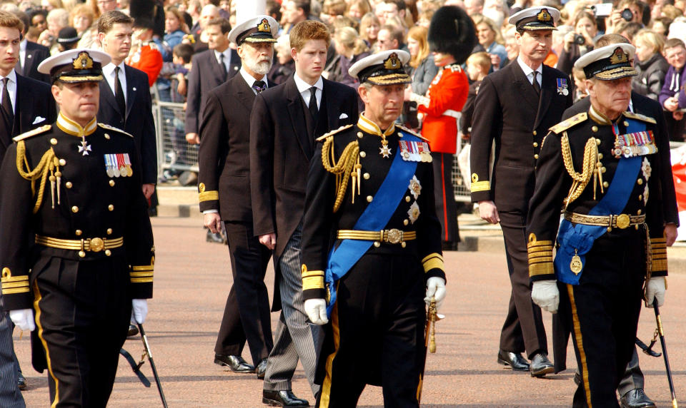 403364 06: Britain's Prince Charles (R), Prince Phillip (C) and Prince Andrew (L) lead Prince Harry and other Royals as they walk behind the coffin bearing the Queen Mother April 5, 2002 as her ceremonial procession makes its way down the Mall in London. The Queen Mother's body will lie in state in Westminster Hall before her funeral in four days. (Photo by Anthony Harvey/Getty Images)