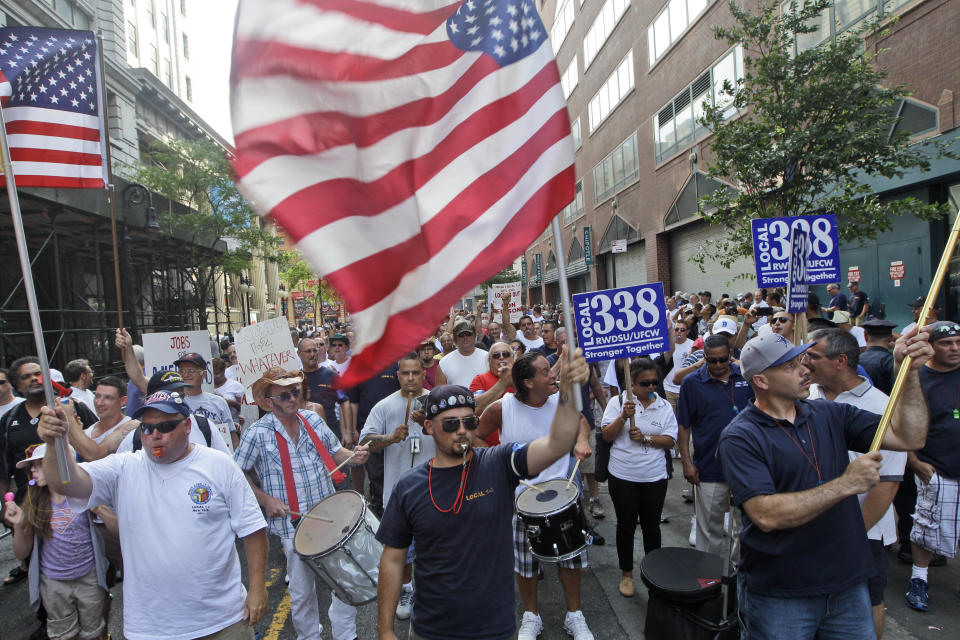 Members of the Utility Workers Union of America Local 1-2 participate in a march and rally in support of locked out Consolidated Edison workers, Tuesday, July 17, 2012 at Union Square in New York. The Con Ed workers were locked out on June 30 after their contract expired and negotiations over a new one failed. About 5,000 managers are keeping electricity going for 3.2 million customers in New York City and Westchester County. (AP Photo/Mary Altaffer)