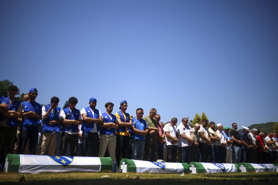 Bosnian muslim man pray during the mass burial ceremony for the 14 newly identified victims of the Srebrenica genocide, at the Srebrenica Memorial Centre, in Potocari, Bosnia, Thursday, July 11, 2024. Thousands gather in the eastern Bosnian town of Srebrenica to commemorate the 29th anniversary on Monday of Europe's only acknowledged genocide since World War II. (AP Photo/Armin Durgut)